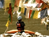 Prayer flags and kayaker